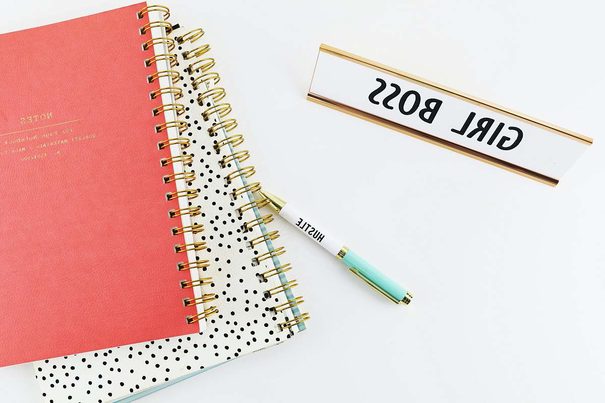 boss two spring notebooks beside ballpoint pen girl boss